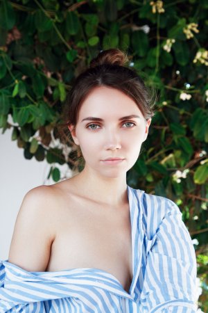 Danniela strips off shirt teasing breasts and parts thighs revealing hairy pussy outdoors — Danniela #6