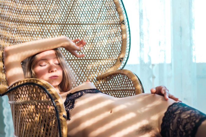 Isla teases with peekaboo bra and stockings, ending in bedroom with flowing hair and tangled sheets — Isla #8