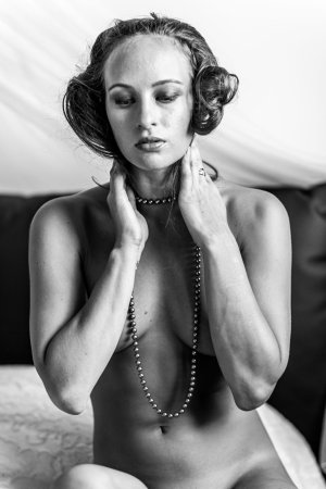 Sally A spreads legs, tan lines gleaming, her body a canvas of creamy skin and erect nipples — Sally A #17