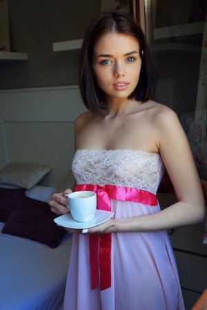 Keira Blue sips coffee by the window, dreaming as she undresses, lace falling away to tease her breasts — Keira Blue #2