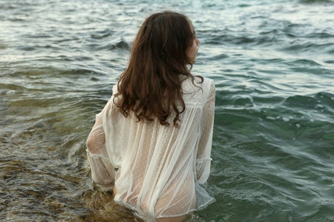 Danniela teases with sheer blouse, legs spread, then she spreads her bare pussy on the beach — Danniela #2