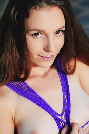 Sofi Shane teases in purple fishnet before baring her natural beauty outdoors