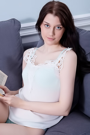 Enid seductively strips on her bedroom couch in sheer camisole before sprawling naked