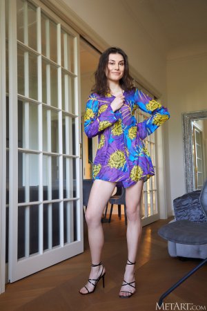 Andrea long legs and perky breasts tease in upskirt chair striptease — Andrea #1