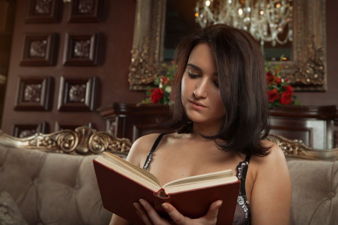 Sanita spreads her legs wide on the couch ending with her puffy nipples exposed — Sanita #1
